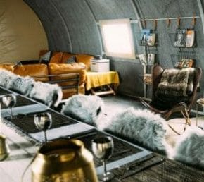 Wolf's Fang camp interior with leather armchairs
