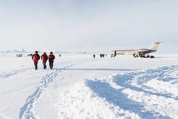 Private aircraft and people walking in Antarctica